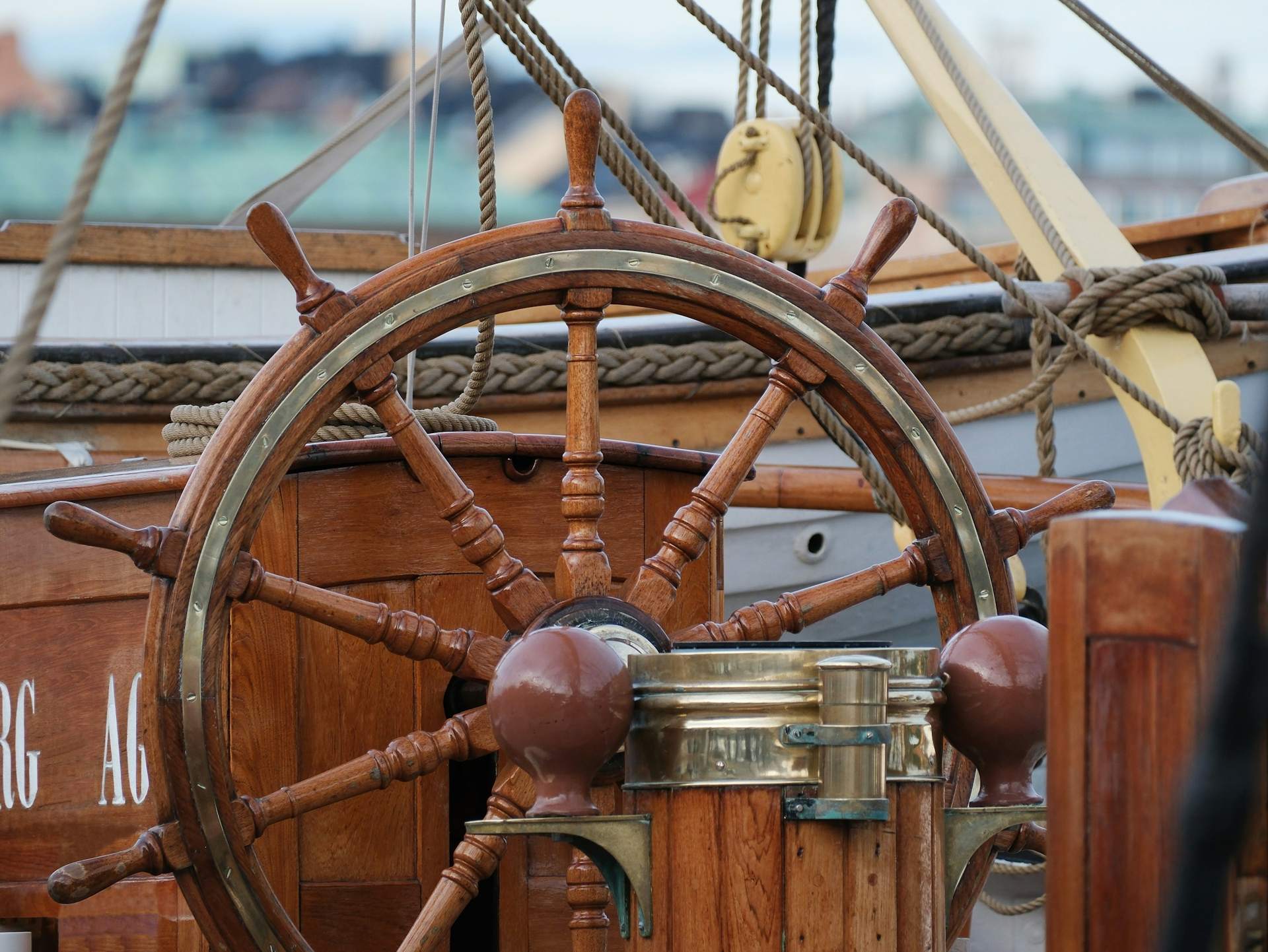 The wooden helm of a classic yacht